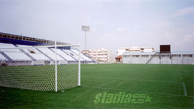 The south stand with the press booths on the left and the new scoreboard on the small gymnasium in the background